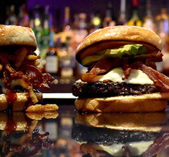 A bacon cheeseburger at the bar